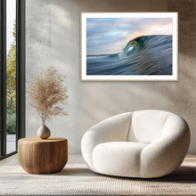 Load image into Gallery viewer, Modern interior with a white armchair, wooden side table, and framed artwork of a wave. decor sapphire coast Photographer Greg Selby