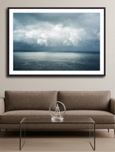 Load image into Gallery viewer, Framed artwork of a stormy sky over water in a living room with a brown sofa and glass coffee table. Greg selby wall hanging south coast nsw decor prints