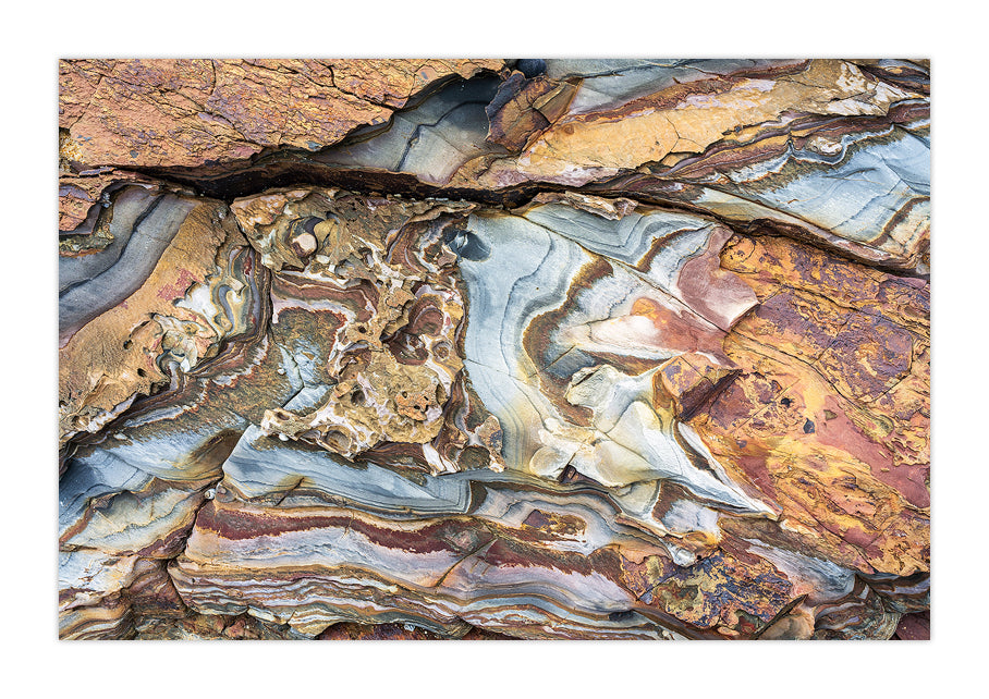 An array of colours and patterns throughout a rock formation