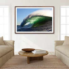 Load image into Gallery viewer, Aurin – massive green barrel wave with tunnel wide open, golden morning light on the face and spray off the lip against a clear blue sky, Australian coastline, fine art photography by Greg Selby


