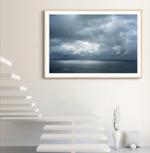 Load image into Gallery viewer, Framed artwork of a cloudy sky over water on a white wall by Greg Selby far south coast NSW