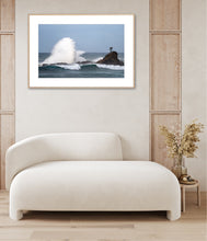 Load image into Gallery viewer, fine art photograph of a powerful ocean wave crashing beside a rocky sea stack at Cuttagee, crowned by a solitary tree symbolising resilience against the force of nature.