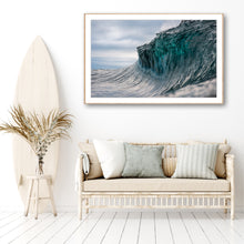Load image into Gallery viewer, Inault — a towering teal ocean wave at peak power, glassy face and sharp edge against a moody sky. Fine art print by Greg Selby.