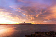 Load image into Gallery viewer, A landscape photograph featuring a body of water with a horizon line in the distance features Mount dromedary , during sunset, with vibrant colors in the sky. Greg Selby art prints South Coast NSW Bermagui