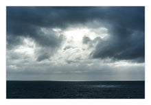 Load image into Gallery viewer, An image of a cloudy sky over the ocean, with a visible sun flare or spotlight on the horizon. Greg Selby South Coast