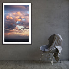 Load image into Gallery viewer, Framed photograph of a colorful sunset with a chair draped with a blanket against a gray wall. Fine art Greg Selby Prints