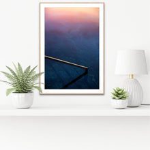 Load image into Gallery viewer, Lull fine art photograph of Bermagui Blue Pool featuring pastel sunrise reflections over deep blue ocean water and a minimalist pool edge in New South Wales, Australia. Far south coast.