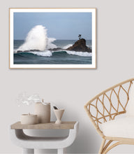 Load image into Gallery viewer, fine art photograph of a powerful ocean wave crashing beside a rocky sea stack at Cuttagee, crowned by a solitary tree symbolising resilience against the force of nature.
