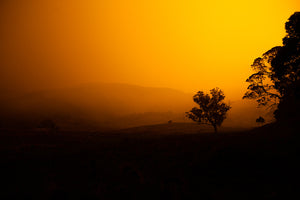 The foot hills of Tilba glowing orange during the fires